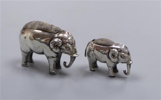 Two small novelty silver elephant pin cushions, Saunders & Shepherd, Birmingham, 1905? & Adie & Lovekin, Birmingham, 1910,